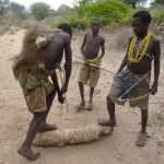 454894-young-hadzabe-boys-practice-their-shooting-skills-lake-eyasi-tanzania